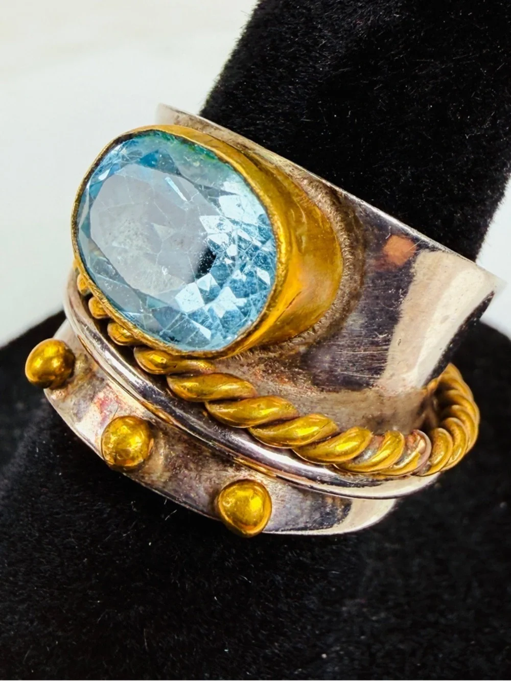 Beautiful size 5 1/2 Silvertone and bronze stamped 925 blue topaz, spinner ring